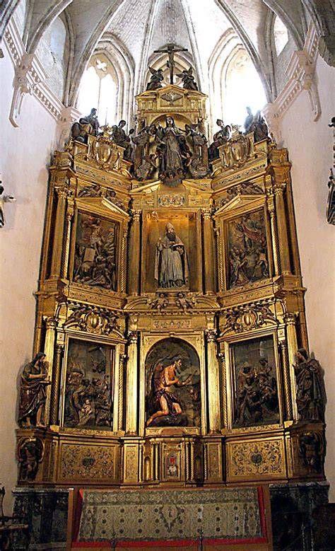 Detalle del retablo mayor en Monasterio San Isidoro del Campo y figura de San Jerónimo Penitente