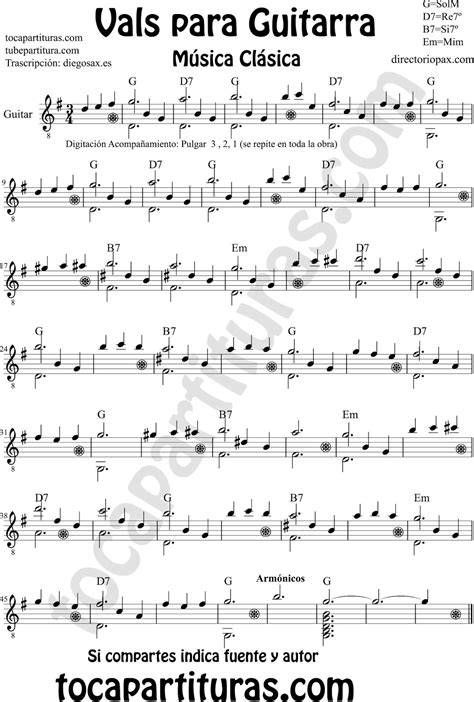Partitura musical y guitarra para canciones religiosas