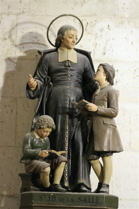 Retrato y estatua de San Juan Bautista de la Salle